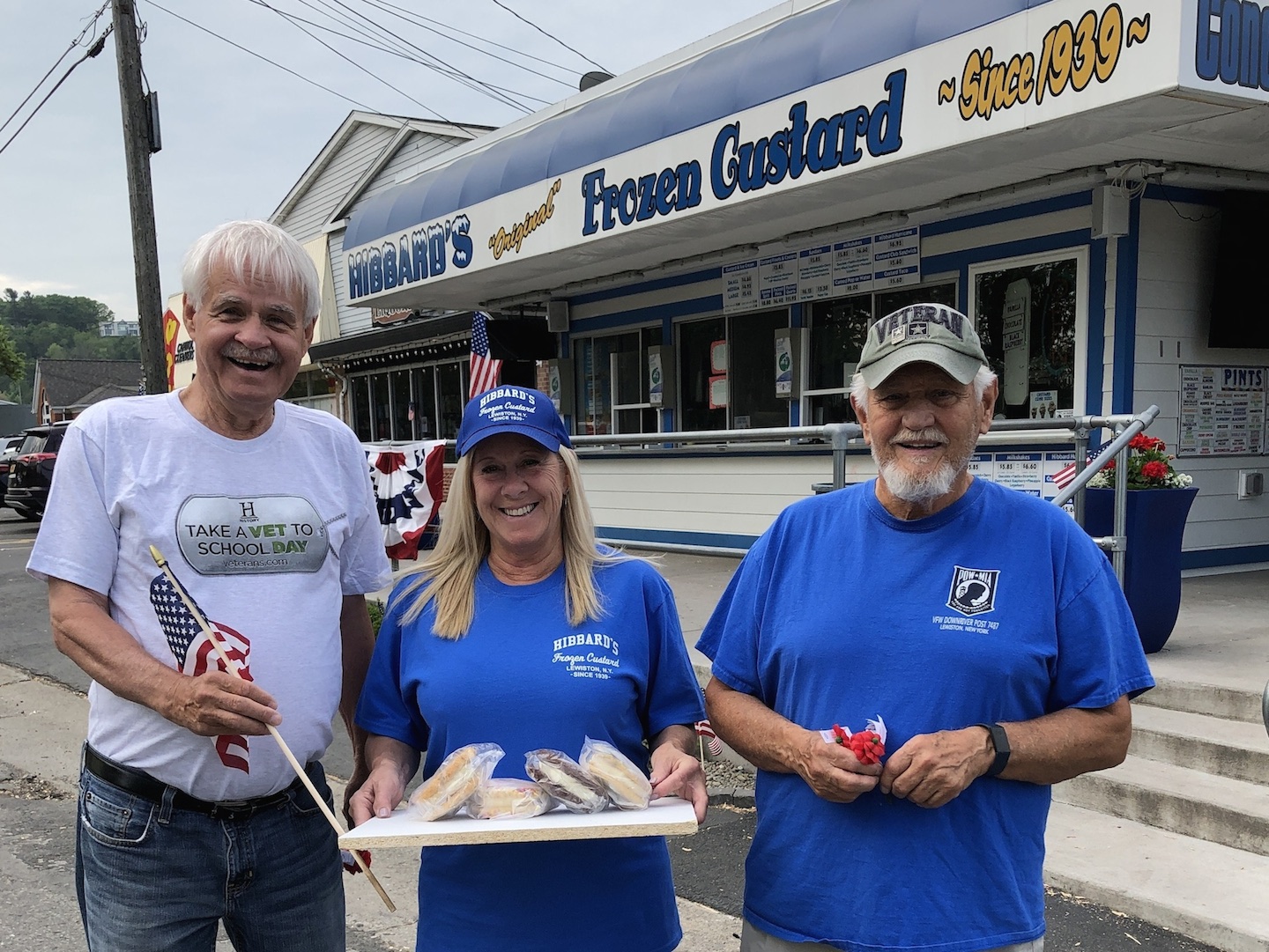 Veterans of Foreign Wars Downriver Post 7487 Cmdr. Bill Justyk and Quartermaster Vince Canosa flank Kris Trunzo of Hibbard's Original Frozen Custard. The iconic Lewiston eatery is donating proceeds to the VFW's `Circle of Honor,` across the street at Academy Park.