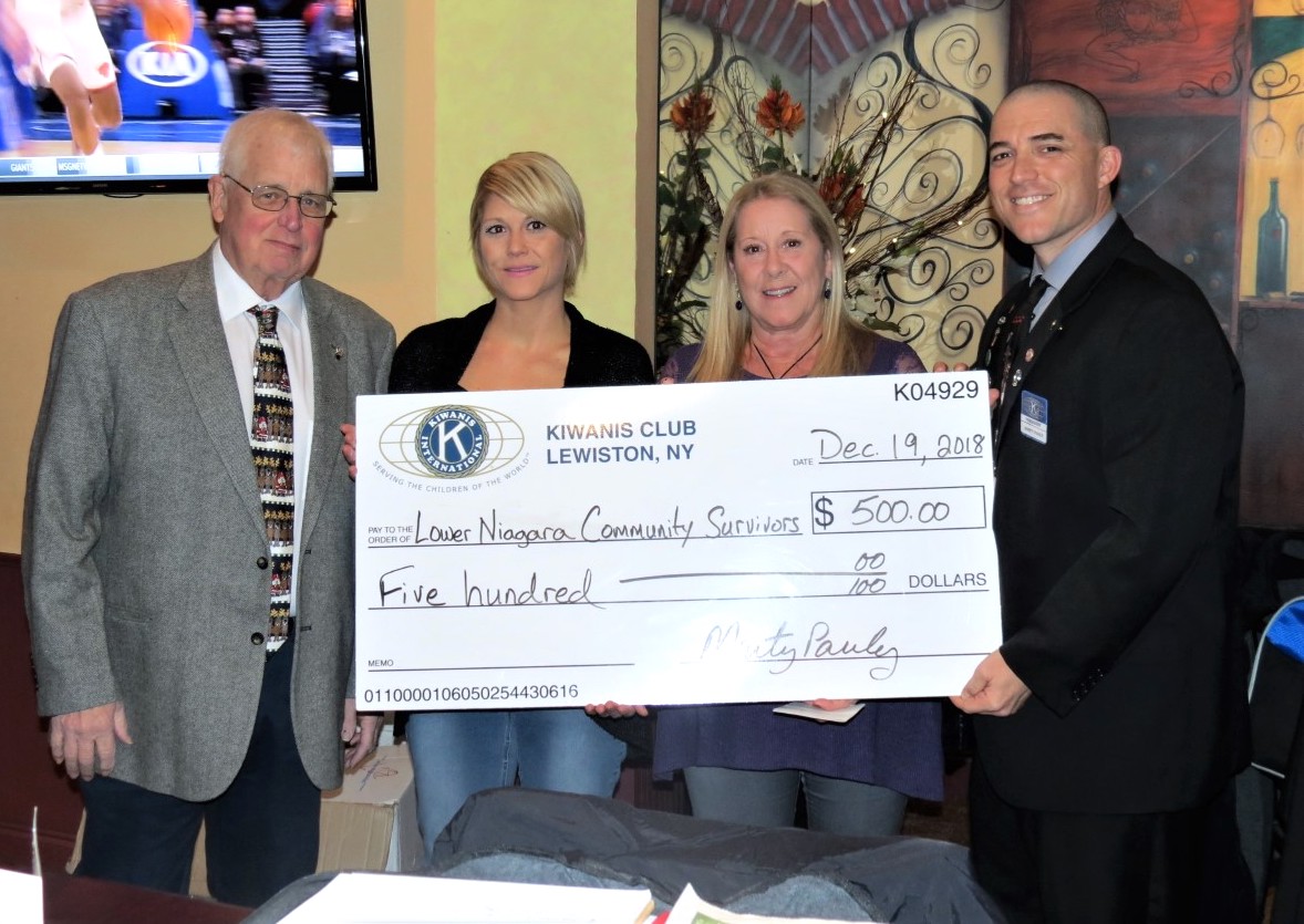 The Kiwanis Club of Lewiston recently presented a check for $500 to the Lower Niagara Community Survivors Group, which provides services (lawn-mowing, snow-blowing, etc.) to area residents battling the disease. Kiwanians John Coulter and Marty Pauly (outside) joined LNCSG members Gina and Kris Trunzo at the check presentation.