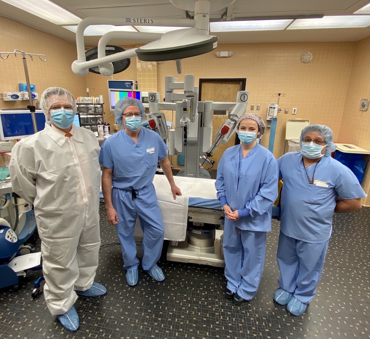 Pictured, from left: CJ Urlaub, general and robotic surgeon Dr. Robert W. Hodge, Amy Vanone and surgical tech Richard Loucks.