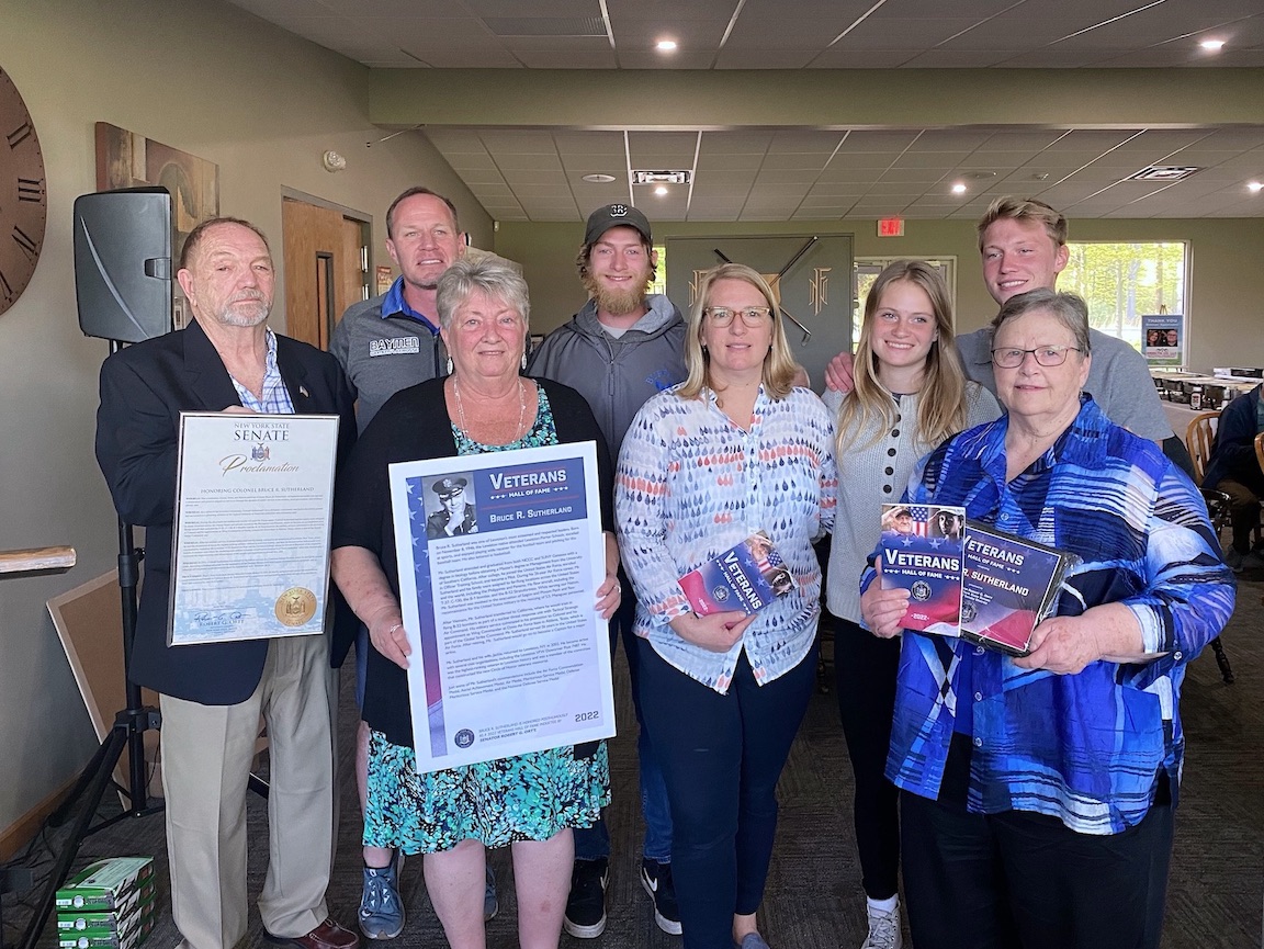 The family of Col. Bruce R. Sutherland receives a senate proclamation and the 2022 Veterans' Hall of Fame nomination from New York State Sen. Robert G. Ortt at the first Bruce R. Sutherland Memorial Golf Tournament. (Submitted photo)