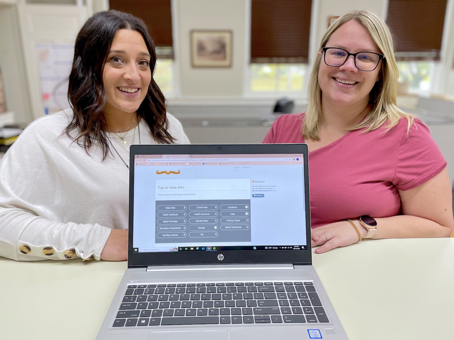 Village of Lewiston Clerk Shannon Fundis, left, and Treasurer Stephanie Longwell show off the municipality's new online payment portal.