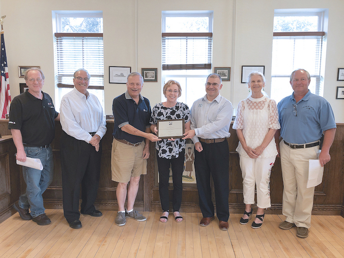 Pictured, from left, with the ACEC New York Engineering Excellence Awards Platinum plaque, are trustees Nick Conde and Dan Gibson, Deputy Mayor Vic Eydt, Mayor Anne Welch, engineer Mike Marino, Trustee Claudia Marasco and Department of Public Works Superintendent Larry Wills.