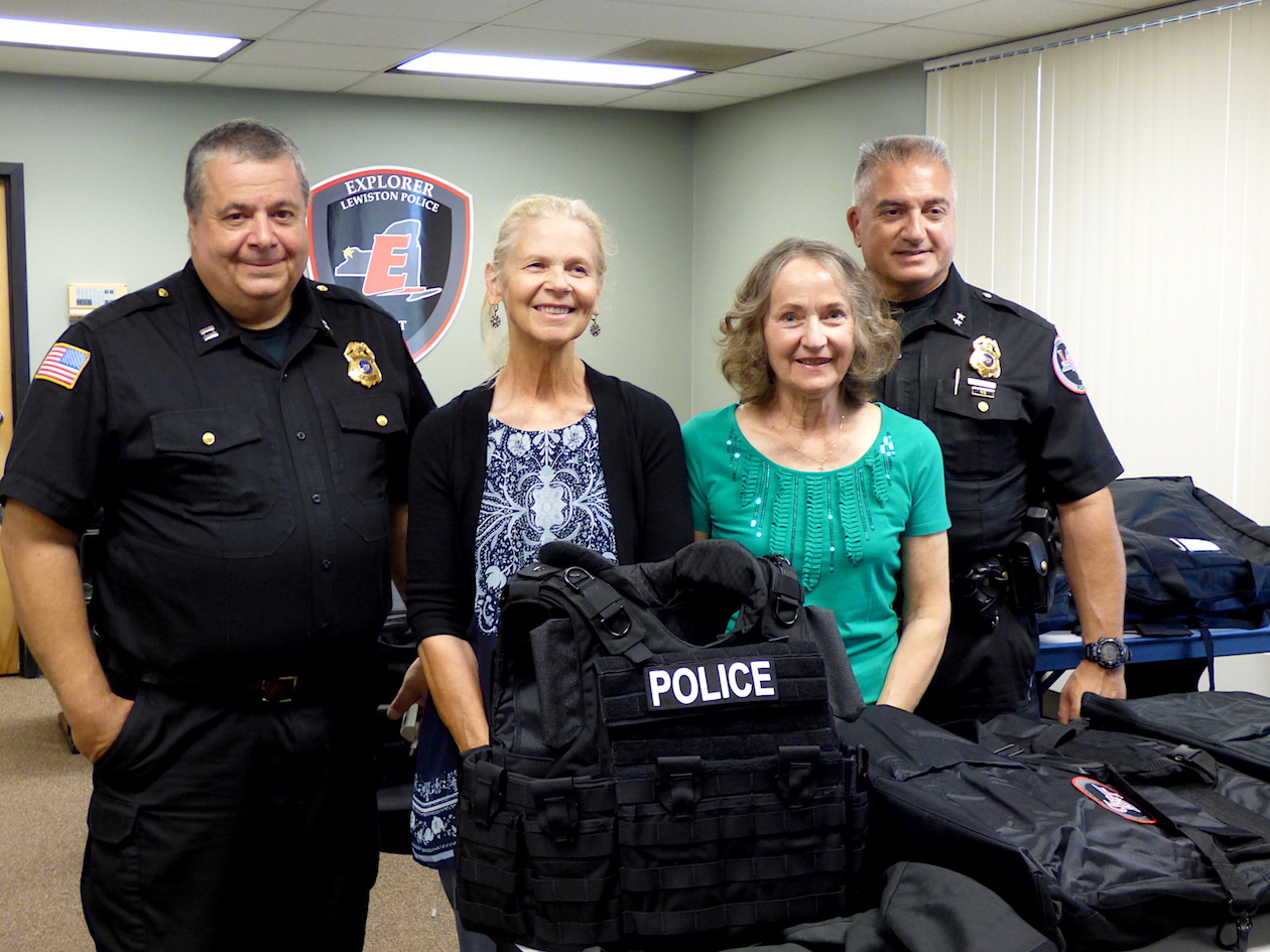 Pictured with Lewiston Police Department Capt. John Penzotti, left, and Chief Frank Previte, are `Invest in a Vest` organizers Claudia Marasco and Arlene Sliz.