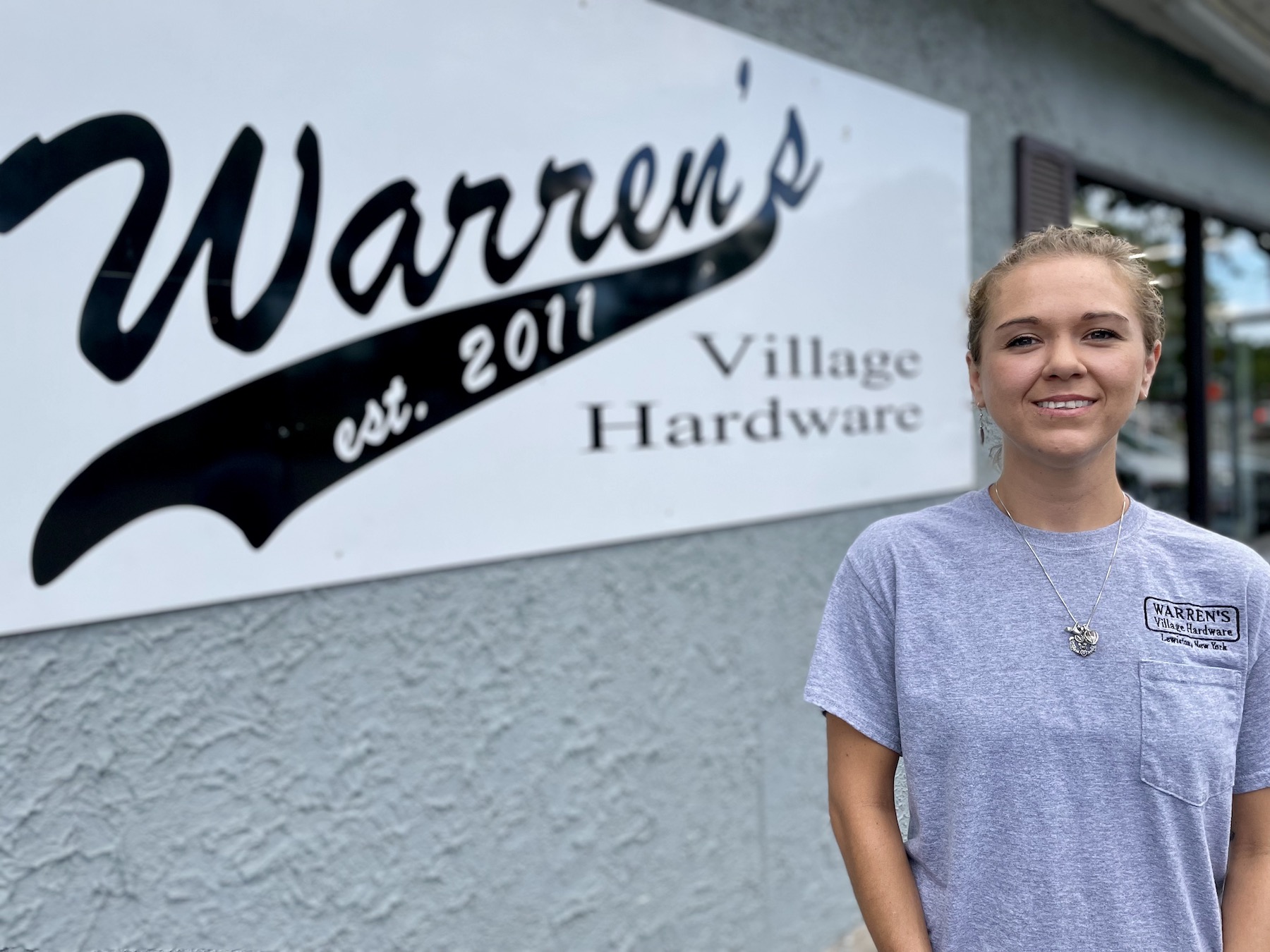 Ashley Warren is shown in front of Warren's Village Hardware at 185 Portage Road. She is taking over the store, working alongside her boyfriend, Rick Wesser.