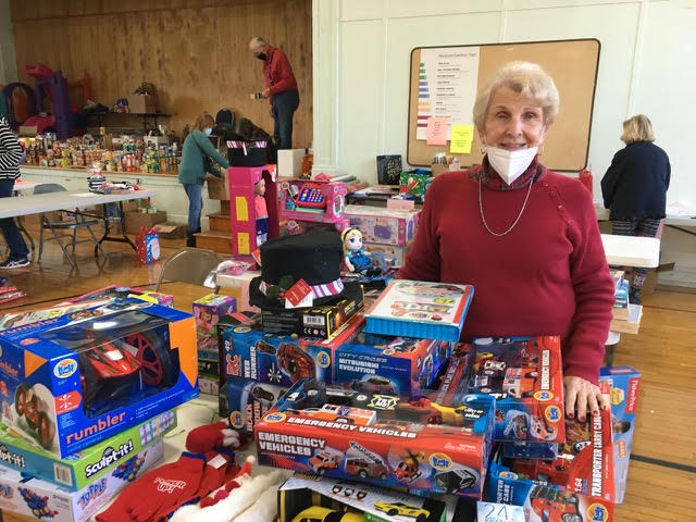 Some of the many volunteer sorters and wrappers of children's gifts who assisted in the Youngstown/Porter Christmas Baskets program. (Submitted photos)