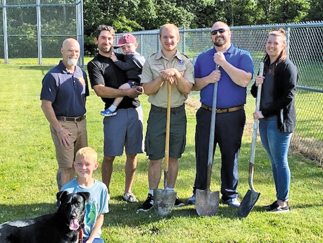 Pictured, from left: Village of Youngstown Trustee Rob Reisman, Recreation Director Jeff Gruarin, Eagle Scout candidate Liam Robinson, Recreation Commission Treasurer Kyle Heath and Trustee Nicole Quarantillo. Winnie the pooch is in the foreground with Andrew Heath.