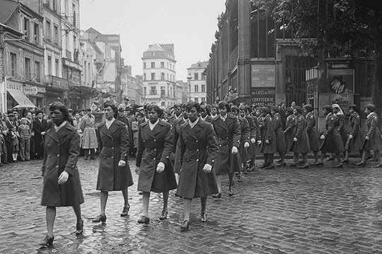 Members of the 6888th Central Postal Directory Battalion take part in a parade ceremony in honor of Joan d'Arc at the marketplace where she was burned at the stake, May 27, 1945. (Image provided by the University at Buffalo)