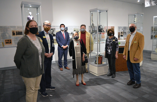 Erie County Executive Mark Poloncarz (third from left) joins members of the Buffalo Presidential Center's board of trustees at the center's opening on Monday at the Central Library in Downtown Buffalo. An extensive collection of more than 10,000 political artifacts is on display in a new, permanent home.