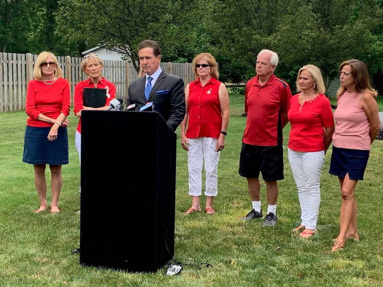 Congressman Brian Higgins joins with Flight 3407 family members last June 11 at the crash site in Clarence, now site of a memorial. (Photos courtesy of the congressman's office)