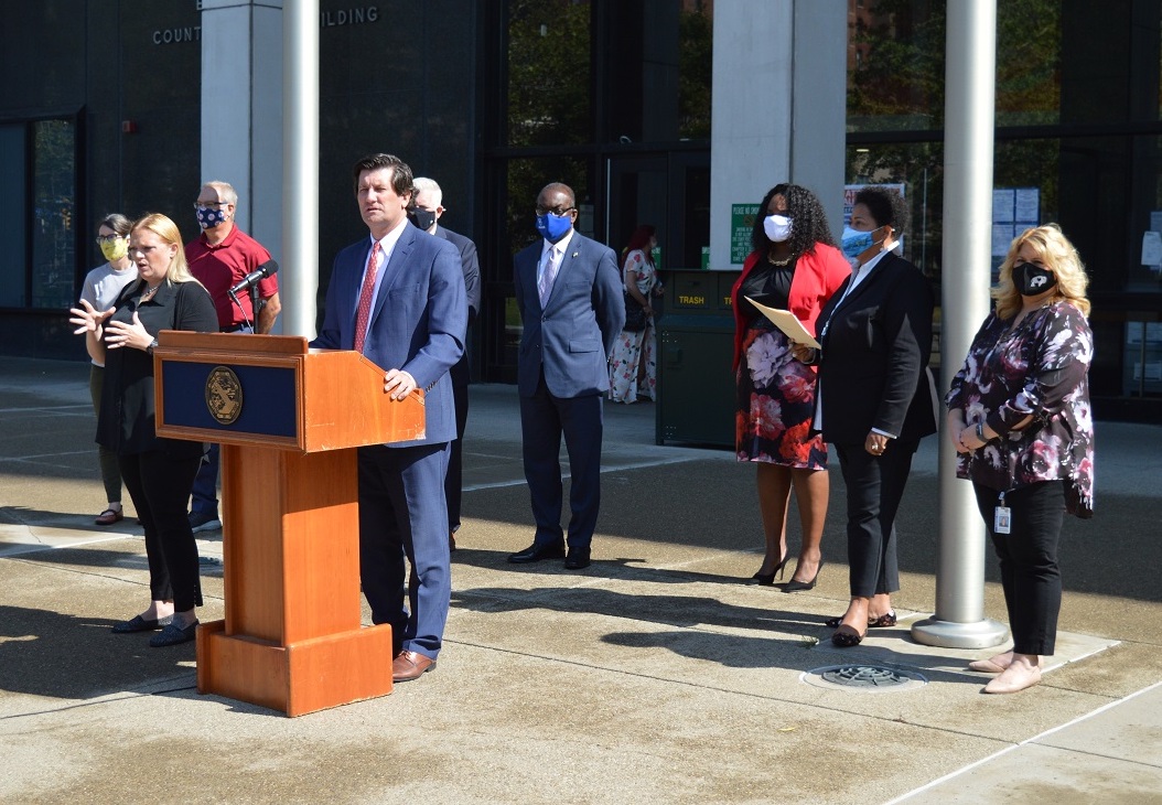 Erie County Executive Mark Poloncarz (at podium) is joined by Buffalo Mayor Byron Brown, Erie County Clerk Michael Kearns, Erie County Legislature Chairwoman April Baskin, Erie County Social Services Commissioner Marie Cannon and members of the Live Well Erie Housing Task Force to announce temporary rent and mortgage assistance to individuals who were unable to pay their rent or mortgage due to circumstances related to the pandemic.