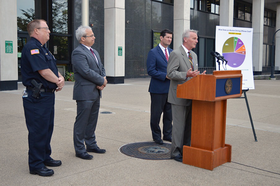 Erie County STOP-DWI Project Coordinator John Sullivan (at podium) is joined by (from left) Town of Hamburg Police Chief Greg Wickett, Erie County Commissioner of Central Police Services Jim Jancewicz and Erie County Executive Mark C. Poloncarz on Monday at the Rath Building in Buffalo to provide an update on driving while intoxicated arrests in Erie County in 2019, and to promote safe driving around the upcoming Fourth of July Weekend.