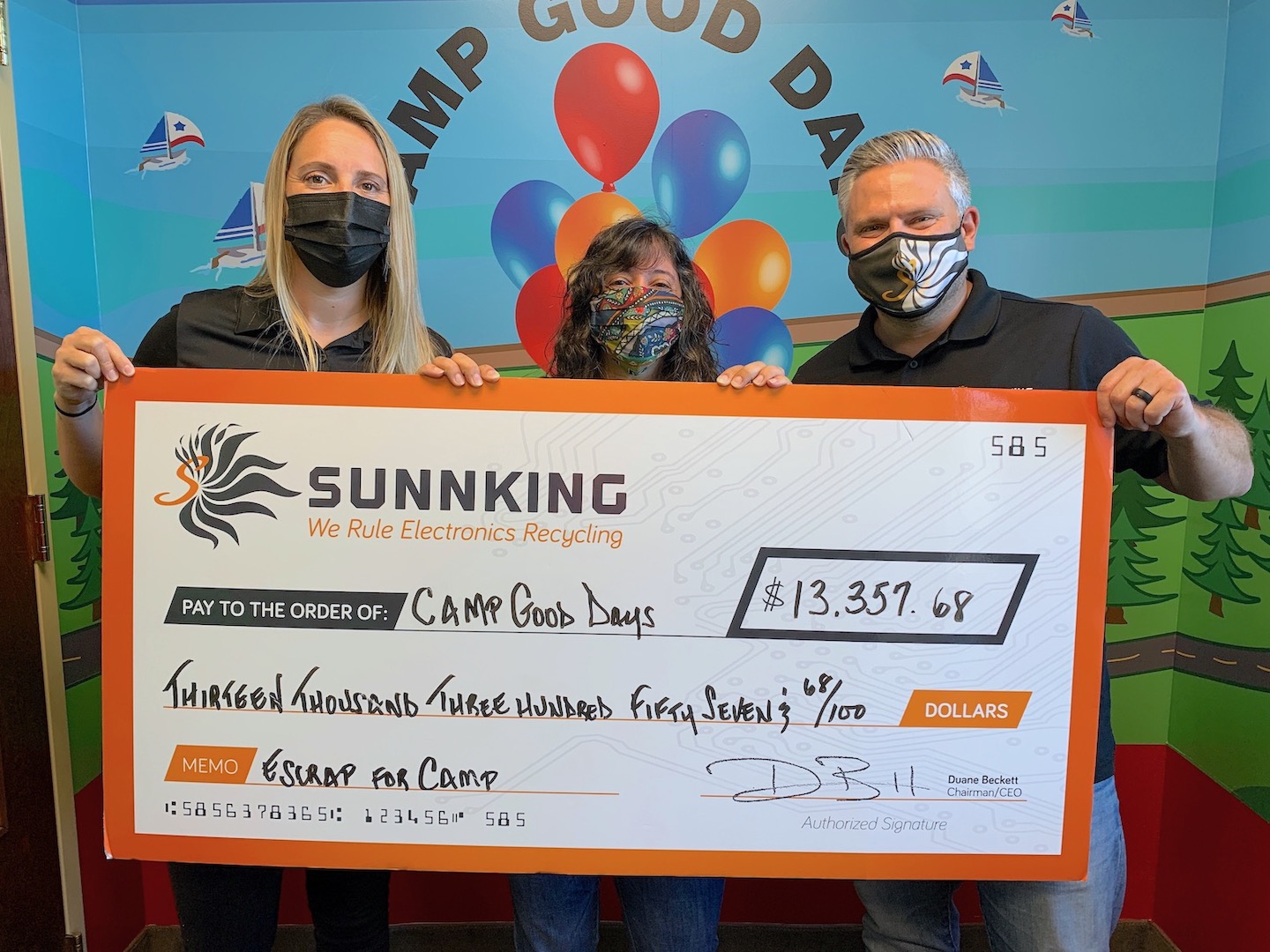 Sunnking presents a check to Camp Good Days to fund future programs. From left are Christina Nelson, Lisa Booz and Adam Shine.