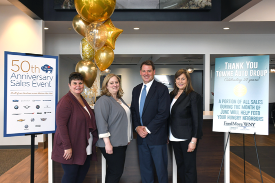 From left: FeedMore WNY Chief Development Officer Lisa Woodring, FeedMore WNY Chief Communications Officer Anne McKenna, Towne Automotive Group President Frank Downing Jr. and his wife, Shari Downing, at the kick-off event at Towne Mazda to celebrate the promotion. 