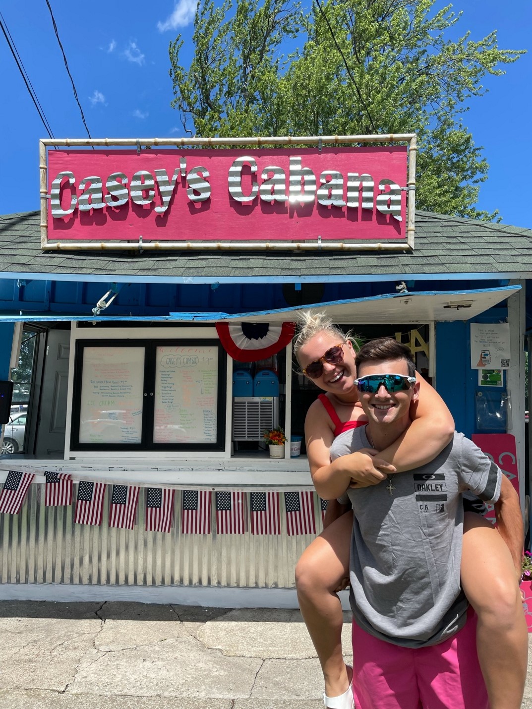 Having fun is part of the job at Casey's Cabana. Founder and owner Gabby Bergstrom gets a ride from Operations Manager Stephen Kaelin. (Photo provided by Casey's Cabana)