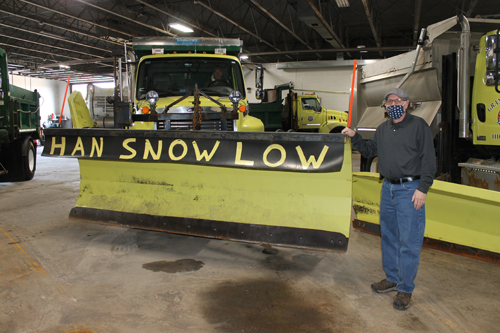 Town Highway Superintendent Richard Crawford stands by one of the town's plows, which playfully sports the phrase `Han Snow Low,` a play on Han Solo, a fictional character in the Star Wars franchise created by George Lucas. (Photo by Karen Carr Keefe)