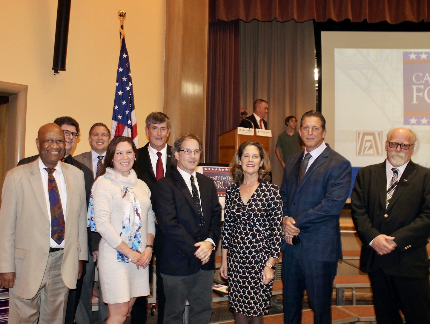 Town political candidates pose before a forum held Tuesday night at Kaegebein Elementary School. From left: Wayne West, Town Board candidate; George Hauss, town clerk candidate; Tom Digati, incumbent Town Board candidate; Kristen Obarka, Town Board candidate; Mike Madigan, supervisor candidate; Mark Nemeth, incumbent town justice candidate; Patricia Frentzel, incumbent town clerk candidate; Dan Kilmer, Town Board candidate; and Pete Marston, supervisor candidate.