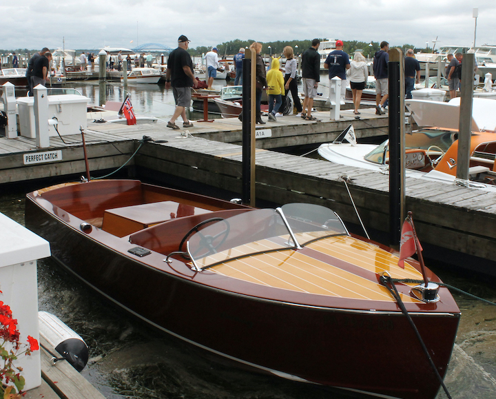 A wooden boat built by the Century Boat Co. gleams in the sunshine at the 44th annual Antique and Classic Boat Show on Saturday at the Buffalo Launch Club, 503 E. River Road. Century Boats were the theme of this year's event. Chairperson Sharon Dickinson of Grande Island said there were at least 40 of the Century Boats in the show.