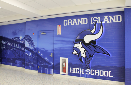 A new Grand Island High School foyer beautification project has brightened the entryway to the school with a deep blue graphic design that incorporates the Viking mascot and the iconic Grand Island bridges. The GIHS Student Council raised the funds for the project. (Photo by Karen Carr Keefe)