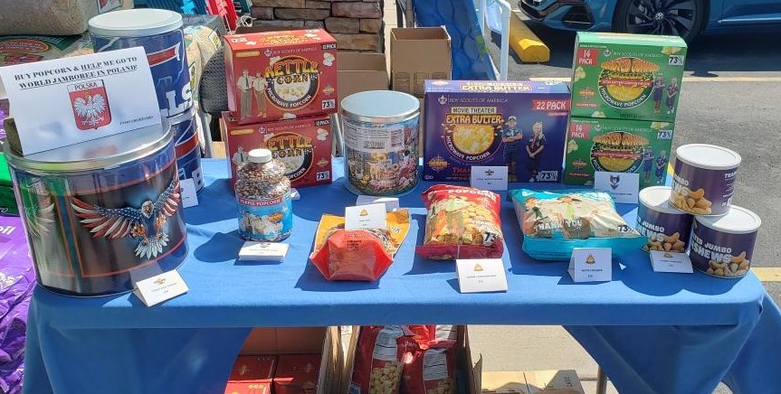 Grayson's table of assorted popcorn items and a donation can for his trip to Poland in 2027. (Photo courtesy of Shelp family)