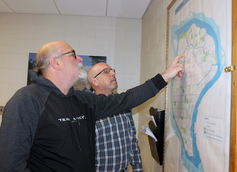 Grand Island Supervisor Peter Marston and town Highway Superintendent Dick Crawford show on a town wetlands map the area that was hit by flooding Jan. 26. That's when 2 inches of rain combined with snow melt to create problems for residents in the vicinity of South Lane and Pin Oak Circle. The neighborhood is near Woods Creek and Spicer Creek.