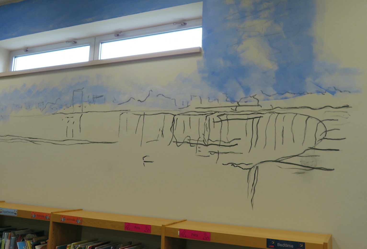 A rough sketch of Niagara Falls is painted on the wall.