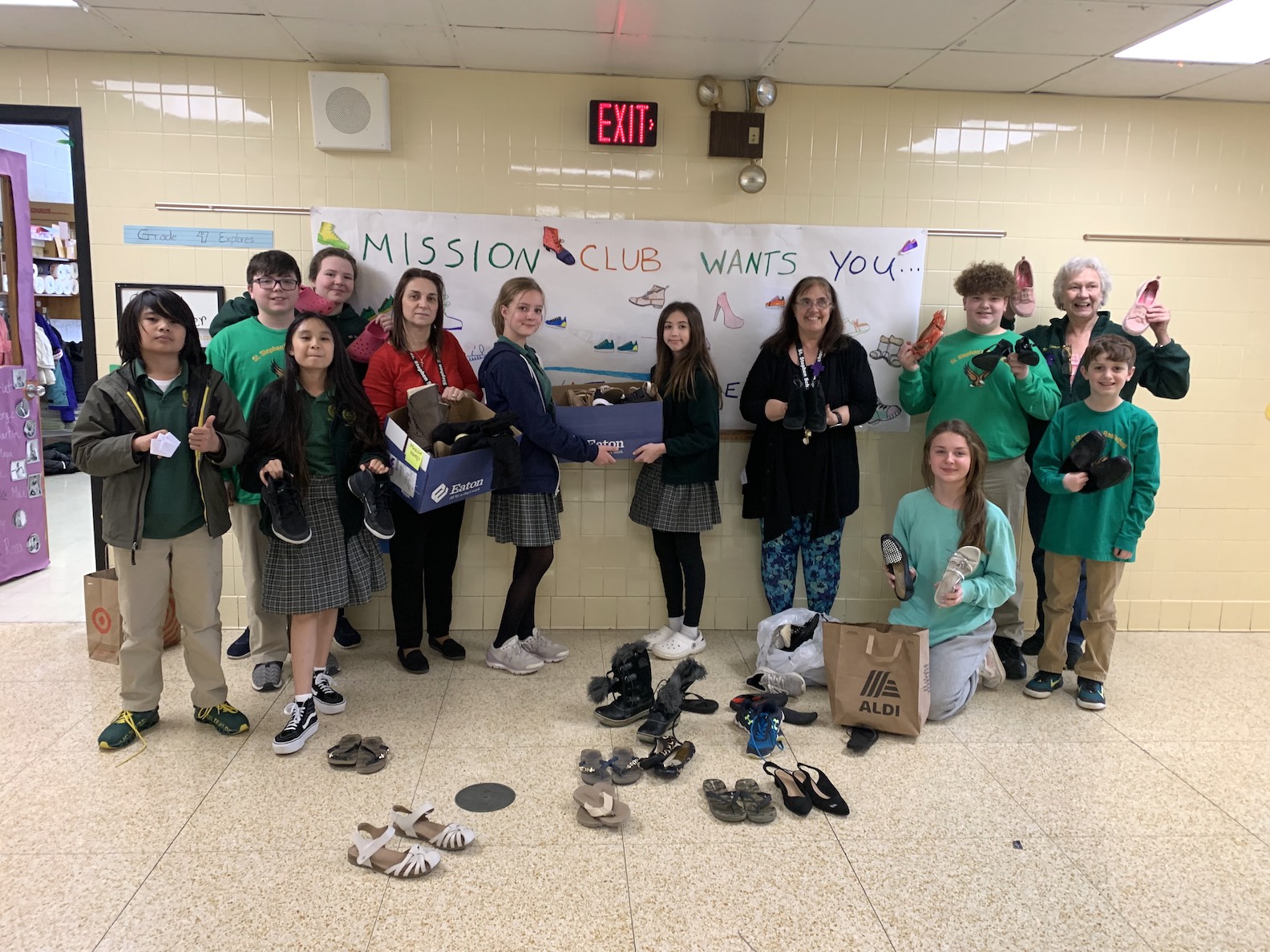Student members of the St. Stephen School mission club collecting shoes from fellow students in a show of true community fellowship. (Photo courtesy of Grand Island Rotary Club)
