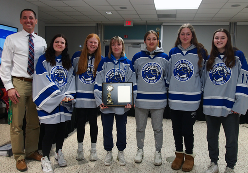 Coach Jeff Orlowski and Grand Island students who are part of the hockey team comprised of students from Grand Island, Kenmore and Lockport. The Grand Island students are Natalie Kopf, Isabella Jayne, Teagan Willats, Megan Pinzel, Ella Johnston and Madison Flory.