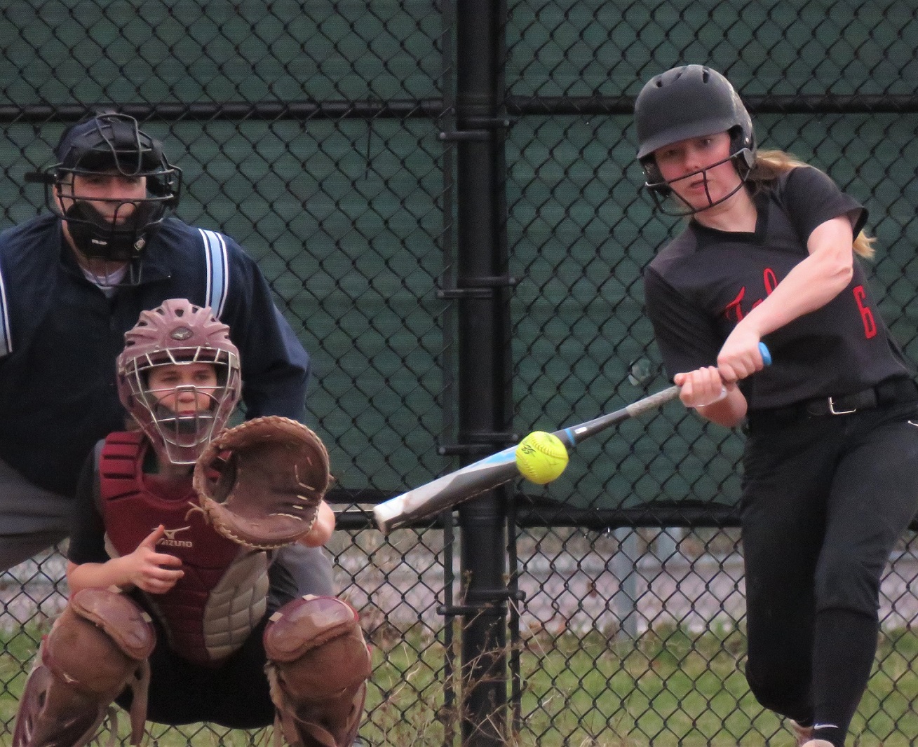 Niagara-Wheatfield Falcons catcher Sydney Crangle ropes a game-tying double to score two runs in the bottom of the fourth inning during a 5-4 victory over Lewiston-Porter. (Photo by David Yarger)