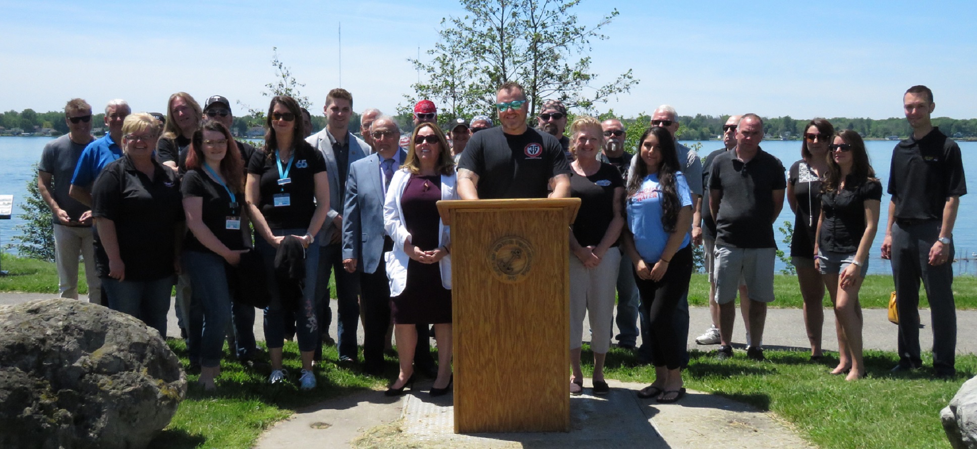 North Tonawanda Mayor Arthur Pappas, Thursdays on the Water promoter Jesse Gooch, city officials, sponsors and other representatives pose for a photo during Friday's presser. (Photo by David Yarger)