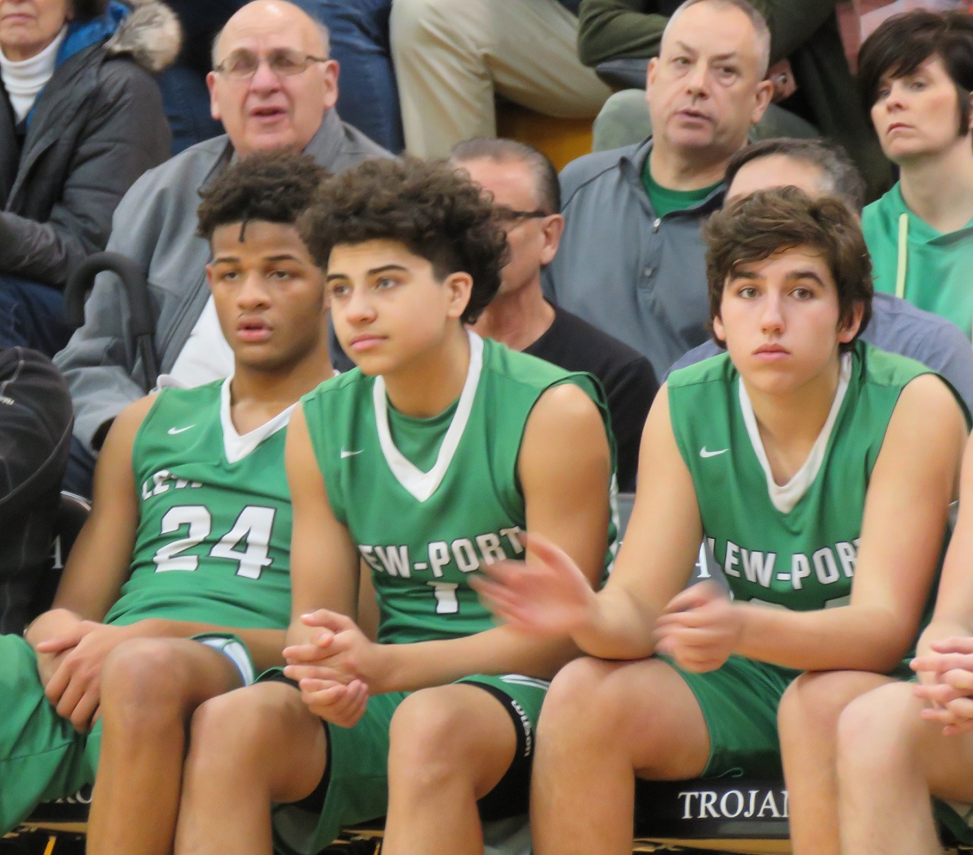 From left, Roddy Gayle, Jalen Duff and Jack Bernstein watch time tick down as the Lewiston-Porter Lancers were defeated by Pittsford-Mendon, 87-55. (Photo by David Yarger)