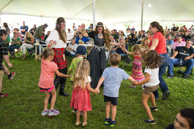 The 22nd Niagara Celtic Heritage Festival & Highland Games will be held Saturday and Sunday, Sept. 16 and 17, at the Niagara County Fairgrounds in Lockport. The hours are 10 a.m. to 10:30 p.m. Saturday; and 10 a.m. to 7 p.m. Sunday. In the photos, children dance to Celtic music, and one of the musical groups performs at a previous Niagara Celtic festival, in the event Music at the Fires. (Photos by Wayne Peters // courtesy of Niagara Celtic Heritage Festival)