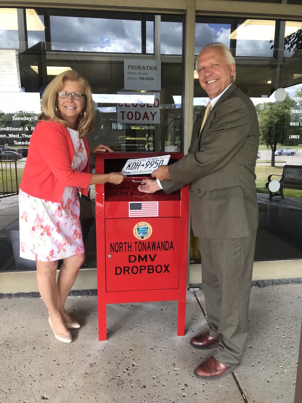 Niagara County Clerk Joseph Jastrzemski with Deputy Clerk Robin Matikosh in front of the newly installed drop box at the North Tonawanda DMV.