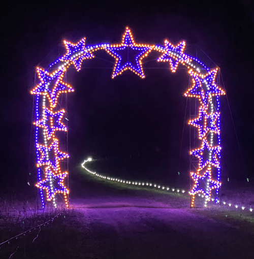 `Arch of Stars` brightens the night sky at the `Holiday Light Show.` It's one of dozens of displays synced to holiday music for families to enjoy in a festive drive-thru. The show runs through Dec. 30. Information and tickets can be found at Holidaylightshow.com. (Submitted photo)