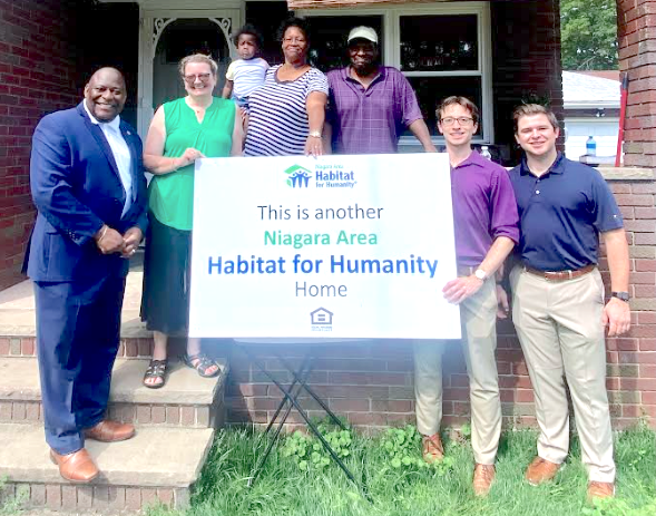 Habitat for Humanity celebrates with the newest homeowners. Pictured from left: Niagara County Legislator Jeffery Elder, Habitat Board President Kaye Lodick, homeowners Andrea and Anthony Stewart, Habitat Community Outreach Director Marco Notaro, and Habitat Board Vice President James Burns. (Submitted photo)