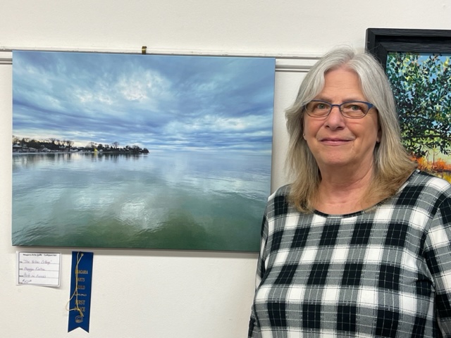 Maggie Eaton and her photo `The Yellow Cottage.` She won Best of Show at Niagara Arts Guild exhibit in Lockport. (Submitted)
