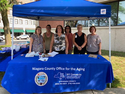 A photo of the Office for the Aging team setting up to distribute coupons outside the offices at 111 Main St., Lockport. Pictured, from left: Stacey Norris, Robin Bayer, Amy Ohlenschlager, Sue Christian, Darlene DiCarlo and Kara Donovan.