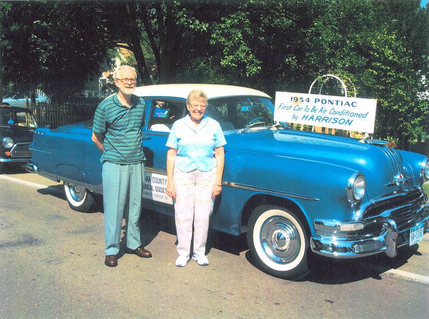 The Rev. Roger and Linda Covell stand beside the Niagara County History Center's 1954 Pontiac. (Submitted photo)