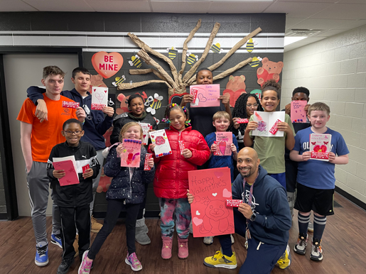 Youth at the Niagara Falls Boys & Girls Club make valentines and pose with their finished gifts. PACE program participants with Women United of Greater Niagara President Joanne Beaton. (Submitted)