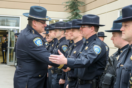 Continuing the tradition of a `walk out,` Niagara County sheriff's deputies lined the sidewalk as former Niagara County Sheriff James Voutour left on his final day. He shook hands and said goodbye to his department members on Dec. 30, 2019. (Images courtesy of the Niagara County Sheriff's Office).