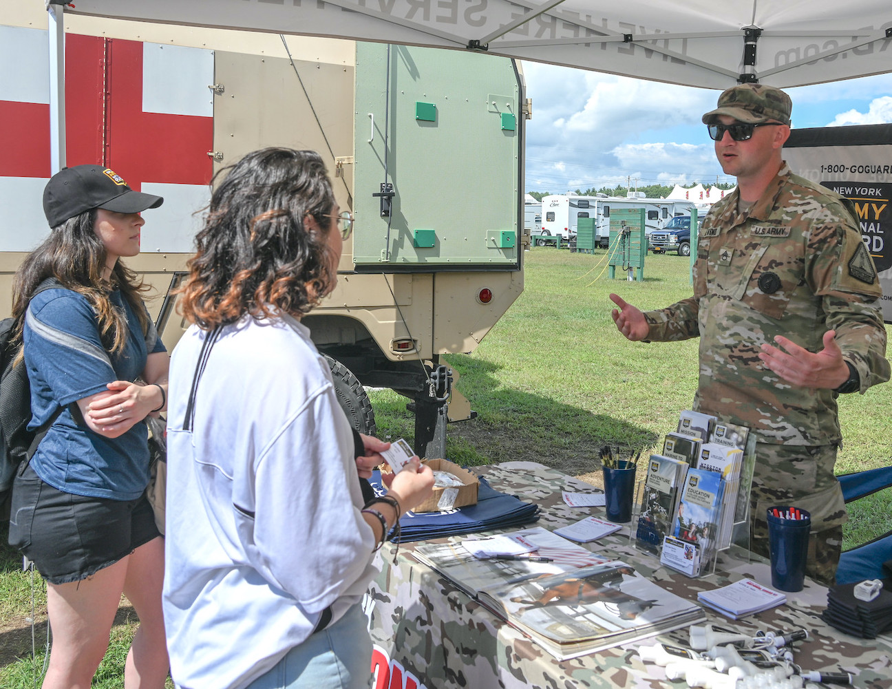 Staff Sgt. Sam Devino, a New York Army National Guard recruiter, chats with fairgoers at the Washington County Fair in Greenwich on Aug. 28. (Submitted photo)