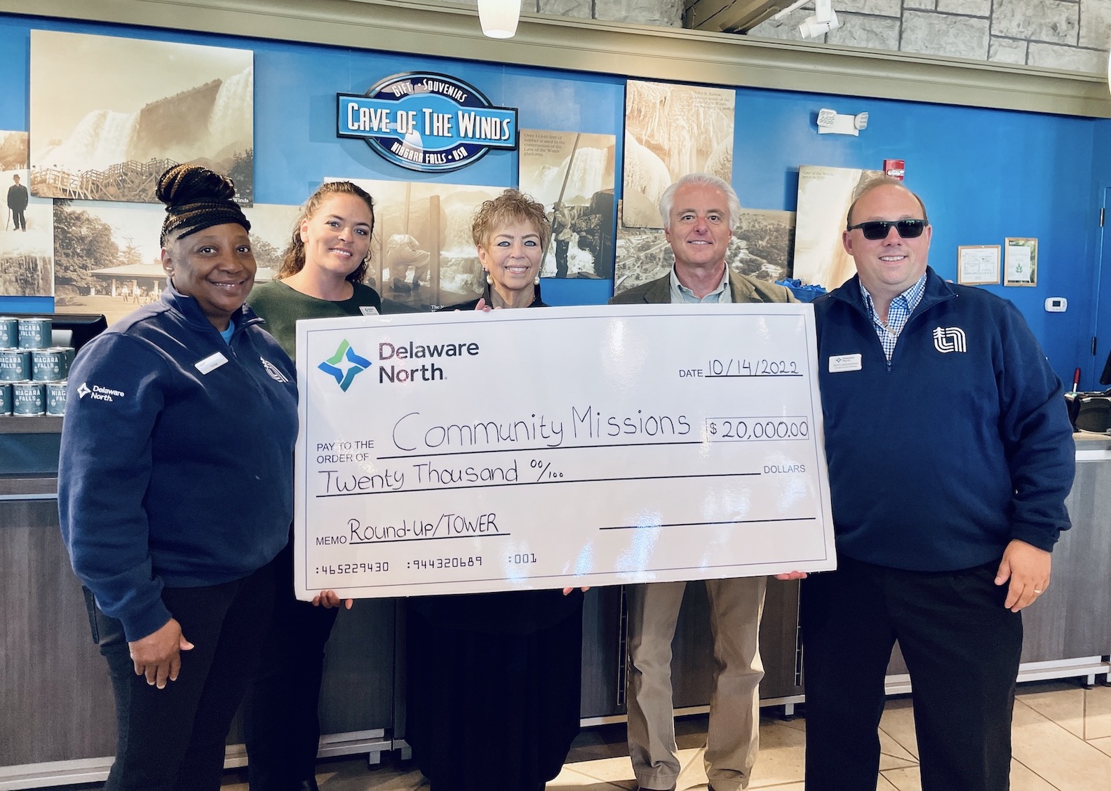 Pictured, from left, at a check presentation Friday: Delaware North employees Teena Harris and Danielle Novak; Community Missions President and CEO Robyn L. Krueger; City of Niagara Falls Mayor Robert Restaino; and Keith Jedlikowski of Delaware North.