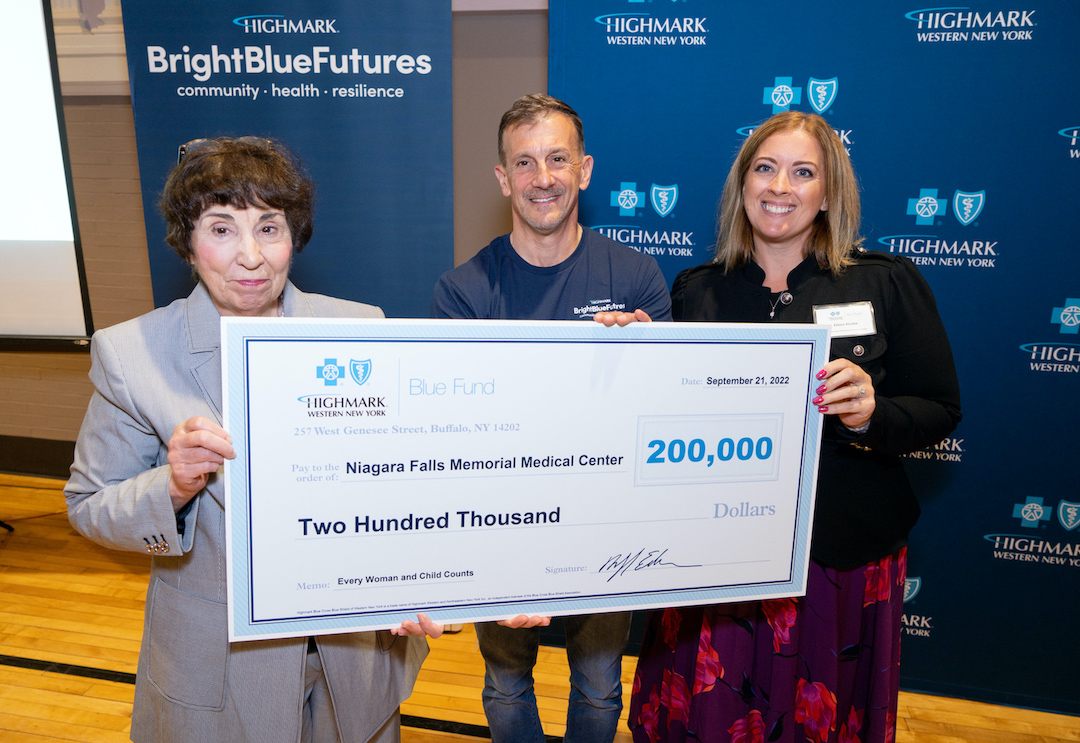 Sheila K. Kee, left, memorial's executive vice president and chief operating officer, is shown with Eileen Kineke, right, maternal & infant health initiative coordinator with Memorial's P3 Center for Teens, Moms & Kids, in receiving the Blue Fund award from Dr. Michael Edbauer, president of Highmark Blue Cross Blue Shield of Western New York. (Photo courtesy of Jordan Lema/provided by Niagara Falls Memorial Medical Center)