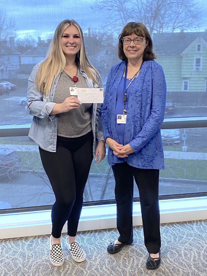 Judy Shahin, right, scholarship chairperson of the Niagara Falls Memorial Medical Center Auxiliary, presents the Esther Werner & Helene Barter Scholarship to Jaedyn Hoyt, an employee of the Schoellkopf Health Center. (Submitted photo)