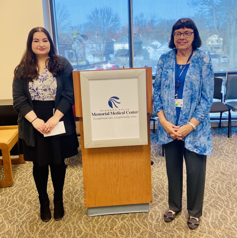 Judy Shahin, right, scholarship chairperson of The Auxiliary of Niagara Falls Memorial Medical Center, presents the Esther Werner & Helene Barter Scholarship to Claire Villanova, an employee of the Child Advocacy Center of Niagara. (Submitted)
