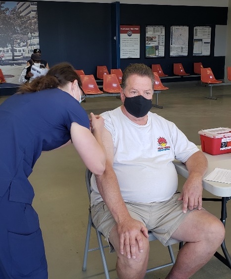 Stephen Pashkutz receives a COVID-19 vaccine shot during last Friday's vaccination clinic at the Portage Road Transportation Center.
