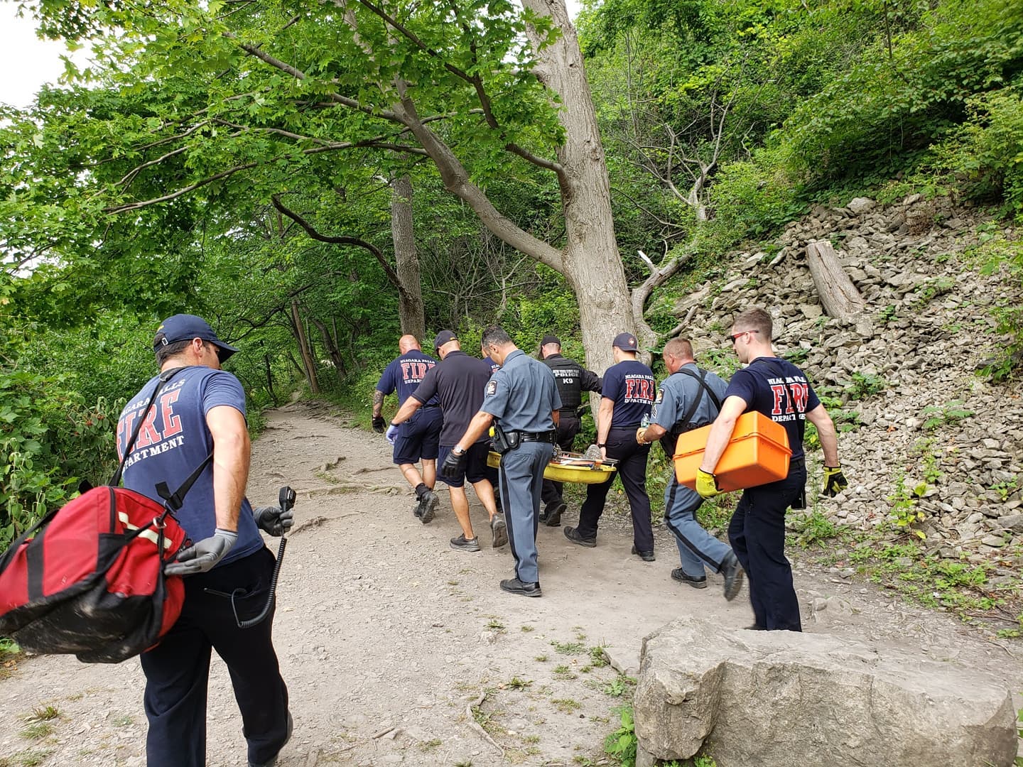 New York State Park Police officers are joined by members of the Niagara Falls Fire Department in executing a carryout rescue of an injured hiker from the Vanderbilt Stairs area of Whirlpool State Park on Sunday, Aug. 8. (Submitted photo)