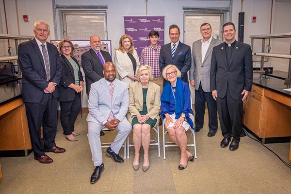 On hand for the announcement of Niagara University's new lab in the Buffalo Niagara Medical Campus were (front, from left): the Rev. Craig Pridgen, NU trustee; Dr. Mary McCourt, NU professor of chemistry; and Pamela Jacobs Vogt, NU trustee; and (back, from left) Dr. Timothy Ireland, provost and vice president of academic affairs; Dr. Debra Colley, executive vice president; Dr. Lawrence Mielnicki, research and teaching laboratory manager at NU; Kathleen Neville, NU trustee; NU senior David Cordone; Congressman Brian Higgins; Patrick Kilcullen, CFO, Buffalo Niagara Medical Campus Inc.; and the Rev. James J. Maher, C.M., NU president.
