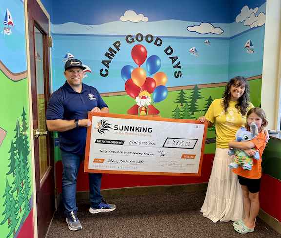 Sunnking presents a check to Camp Good Days to fund future programs. From left: Sunnking President Adam Shine, Camp Good Days COO Lisa Booz, and cancer survivor Lily Weekes. (Sunnking photos)