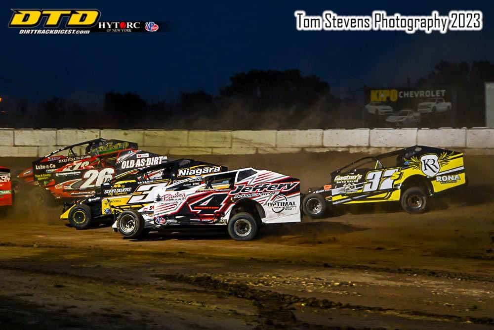 Four-wide in 358 mod action, with John Smith (678), Luke Carleton (26c), Chad Brachmann (3) and Greg Martin (4), with Gary Lindberg (37s) racing right behind. (Tom Stevens photo)