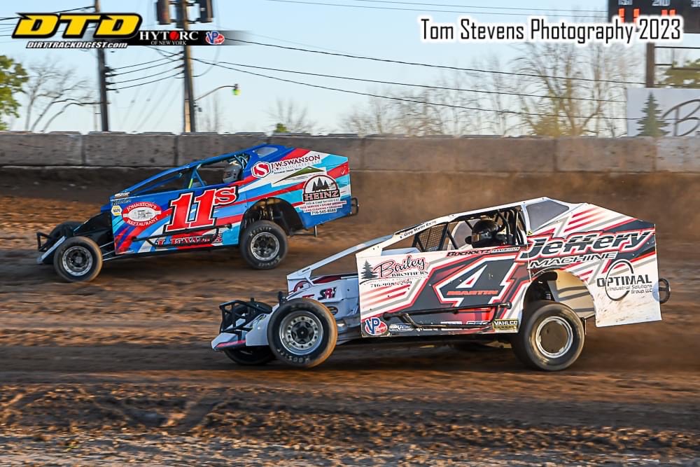 Steve Lewis Jr. (11s) leads Greg Martin (4) in 358 Modified action at the `Big R` in 2023 (Photo by Tom Stevens)